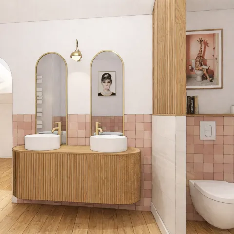 Double vasque sur meuble en bois cannelé avec carreaux roses et miroirs arqués dorés